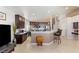 Open concept kitchen with bar seating and adjacent breakfast nook at 8894 Don Horton Ave, Las Vegas, NV 89178
