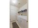The laundry room has a washer, dryer, and storage shelves above it at 8894 Don Horton Ave, Las Vegas, NV 89178