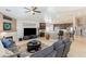 Comfortable living room with a fireplace, large TV, and open kitchen view at 8894 Don Horton Ave, Las Vegas, NV 89178