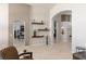 Spacious living area showcasing archways, floating shelves, and a seamless flow to other rooms at 8894 Don Horton Ave, Las Vegas, NV 89178
