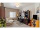 Cozy home office boasts bookshelves, a plush armchair, and an organized workspace at 8894 Don Horton Ave, Las Vegas, NV 89178