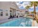 A luxurious pool and patio area with a built-in spa and mature landscaping at 8894 Don Horton Ave, Las Vegas, NV 89178