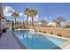 Inviting pool and spa area with ample seating and desert landscape with mature trees at 8894 Don Horton Ave, Las Vegas, NV 89178