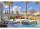 Backyard with a refreshing pool, jacuzzi and tropical landscaping, creating an oasis for relaxation at 8894 Don Horton Ave, Las Vegas, NV 89178