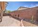 Expansive backyard with a concrete patio and privacy wall lined with greenery, perfect for entertaining at 9193 Black Slate St, Las Vegas, NV 89123