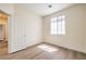 Bright bedroom features a window allowing natural light and light wood-look floors at 9193 Black Slate St, Las Vegas, NV 89123
