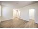 Bright bedroom features multiple entry doors and light wood-look floors at 9193 Black Slate St, Las Vegas, NV 89123