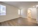 Bright bedroom features multiple windows allowing natural light and light wood-look floors at 9193 Black Slate St, Las Vegas, NV 89123