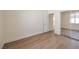 Bright bedroom features a mirrored closet door and light wood-look floors at 9193 Black Slate St, Las Vegas, NV 89123
