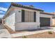 Charming single story home featuring desert landscaping, a tile roof and gray garage door at 9193 Black Slate St, Las Vegas, NV 89123
