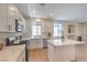 Open kitchen boasts stainless appliances, a large center island, and modern finishes at 9193 Black Slate St, Las Vegas, NV 89123