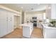 Modern kitchen featuring white cabinets, a center island, and stainless steel appliances at 9193 Black Slate St, Las Vegas, NV 89123
