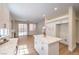 Spacious kitchen flows into living area, featuring a center island and modern appliances at 9193 Black Slate St, Las Vegas, NV 89123
