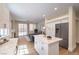 Open kitchen and living area with stainless steel appliances and modern decor at 9193 Black Slate St, Las Vegas, NV 89123