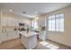 Bright kitchen features a center island, stainless appliances, and white cabinets at 9193 Black Slate St, Las Vegas, NV 89123