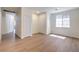 Spacious living room featuring new flooring, neutral paint, and multiple doors to other rooms at 9193 Black Slate St, Las Vegas, NV 89123