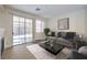 Comfortable living room with modern furnishings, fireplace, and access to outdoor patio at 9193 Black Slate St, Las Vegas, NV 89123