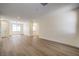 Spacious unfurnished living room featuring new flooring, modern fixtures, and natural light at 9193 Black Slate St, Las Vegas, NV 89123