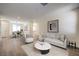 Stylishly furnished open-concept living room with new flooring and lots of natural light at 9193 Black Slate St, Las Vegas, NV 89123