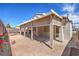 Covered patio area with a textured concrete floor, providing a great outdoor living space at 9193 Black Slate St, Las Vegas, NV 89123