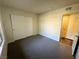 Bedroom featuring neutral carpeting, closet, and a door to the hallway at , Henderson, NV 89014