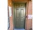 The olive green front door provides security and classic style to this charming, well-maintained condominium at , Henderson, NV 89014
