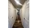 Hallway with wood floors, neutral walls, and doors leading to other rooms at , Henderson, NV 89014