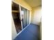 A spacious patio features a sliding door and white storage closet adjacent to the bright blue concrete pad at , Henderson, NV 89014