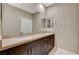 Bathroom featuring double sinks with a large mirror and stylish cabinet hardware at 1541 Unison Way # 102, Las Vegas, NV 89135