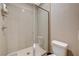 Bathroom featuring a glass shower with tile surround and built-in seating at 1541 Unison Way # 102, Las Vegas, NV 89135