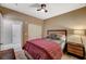 Comfortable bedroom with a queen bed, closet, and a nightstand with a lamp at 1541 Unison Way # 102, Las Vegas, NV 89135