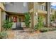 Inviting townhouse showcasing a brick walkway, small yard, and a stylish front entrance at 1541 Unison Way # 102, Las Vegas, NV 89135