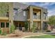 Beautiful three-story townhouse featuring modern architectural design and desert landscaping at 1541 Unison Way # 102, Las Vegas, NV 89135