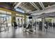 Community gym featuring cardio machines, weightlifting stations, and a view of the outdoor pool area at 1541 Unison Way # 102, Las Vegas, NV 89135