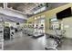 Bright gym area with treadmills, weights, and machines, featuring a wall mural and ample natural light at 1541 Unison Way # 102, Las Vegas, NV 89135