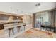 Well-lit kitchen with an island, pendant lighting, stainless steel appliances and modern cabinetry at 1541 Unison Way # 102, Las Vegas, NV 89135