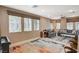 Comfortable living room with large windows, modern furnishings, and a neutral color palette at 1541 Unison Way # 102, Las Vegas, NV 89135