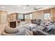 Open-concept living space with natural light, comfortable seating, and a view of the kitchen and patio at 1541 Unison Way # 102, Las Vegas, NV 89135