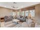 Inviting living room with multiple windows, comfortable seating, and stylish decor at 1541 Unison Way # 102, Las Vegas, NV 89135