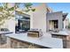 Outdoor grilling area with stone counters, stainless steel grills, and seating for residents to enjoy at 1541 Unison Way # 102, Las Vegas, NV 89135