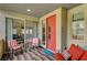 Charming patio with seating, a view to the living area through sliding doors, and a stylish front door at 1541 Unison Way # 102, Las Vegas, NV 89135