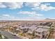Expansive aerial view of the community with desert mountains in the distance at 160 Lilt Ave, Henderson, NV 89011