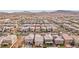High-angle view shows rows of houses in the community, neatly arranged streets at 160 Lilt Ave, Henderson, NV 89011