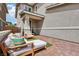 Back patio featuring a comfortable outdoor seating area with brick pavers for a relaxing retreat at 160 Lilt Ave, Henderson, NV 89011
