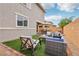 Relaxing backyard with a furnished patio, artificial grass, and a brick privacy wall at 160 Lilt Ave, Henderson, NV 89011