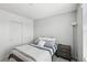 Clean bedroom featuring gray and white bedding, light walls, and ample natural light from a window at 160 Lilt Ave, Henderson, NV 89011