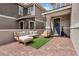 Inviting front porch with stylish outdoor furniture and a welcoming entrance door at 160 Lilt Ave, Henderson, NV 89011