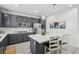 Modern kitchen featuring white countertops, a large kitchen island, stainless appliances, and pendant lighting at 160 Lilt Ave, Henderson, NV 89011