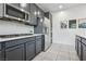 Modern kitchen showcasing stainless steel appliances, grey cabinets and white countertops at 160 Lilt Ave, Henderson, NV 89011
