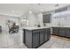 Modern kitchen featuring white countertops, a large kitchen island, stainless appliances, and pendant lighting at 160 Lilt Ave, Henderson, NV 89011